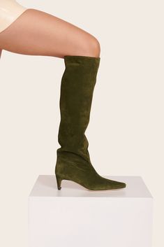 The Wally is a slouchy, suede knee-high boot featuring a pointed toe and a slim heel design. Suede Boots Knee High, Heel Design, Crossbody Clutch, Wedge Sneakers, Green Suede, Handbag Shoes, Designer Heels, Sandals Summer, Suede Boots