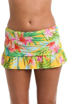 Built-in bikini bottoms ensure you feel confident while you lounge by the water in this ruffled swim skirt featuring a bold tropical pattern. Full back coverage Lined 83% nylon, 17% elastane Hand wash, line dry Imported Fitted Tropical Swim Trunks For Pool, Beach Skort With Ruffles And Stretch, Beach Skort With Stretch Ruffles, Stretch Ruffle Skort For The Beach, Stretch Ruffled Skort For The Beach, Fitted Hawaiian Style Bottoms For Poolside, Fitted Ruffle Skort For Beach, Fitted Ruffles Skort For Beach, Fitted Ruffled Skort For Beach