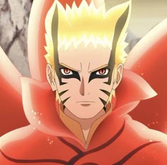 an anime character with yellow hair and red cape on his head, staring at the camera