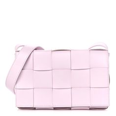 This is an authentic BOTTEGA VENETA Lambskin Maxi Intrecciato Cassette Crossbody Bag in Bliss Washed. This stylish messenger bag is crafted of tightly woven lambskin leather in pale pink. The bag features a matching adjustable crossbody strap with aged silver hardware and a front flap. The flap opens to a smooth leather interior with a zipper pocket. Pink Intrecciato Weave Rectangular Bag, Pink Rectangular Bag With Intrecciato Weave, Pink Woven Leather Bag, Luxury Pink Shoulder Bag With Intrecciato Weave, Rectangular Intrecciato Shoulder Bag For Evenings, Rectangular Intrecciato Weave Shoulder Bag For Evening, Rectangular Intrecciato Weave Evening Shoulder Bag, Designer Rectangular Shoulder Bag With Intrecciato Weave, Pink Rectangular Woven Leather Bag