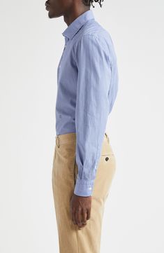 Cut from lightweight, breathable cotton, this softly relaxed button-up shirt is designed with a narrow, slightly pointed yoke in back. 31 1/2" length; 43" chest (size Medium) Front button closure Spread collar Long sleeves with button cuffs 100% cotton Dry clean or machine wash, line dry Made in Italy Designer Clothing Cotton Dress Shirt With Concealed Placket For Daywear, Relaxed Fit Shirt With Concealed Placket, Casual Shirt With Shirttail Hem And Button Closure, Cotton Tops With Concealed Placket For Daywear, Unstructured Shirt With Spread Collar For Daywear, Unstructured Long Sleeve Shirt For Daywear, Blue Cotton Top With Concealed Placket, Relaxed Fit Dress Shirt With Button Closure For Daywear, Casual Shirt With Concealed Placket For Daywear