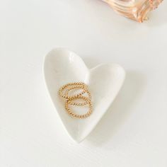 Stack those fingers in gold with the Triple B Rings. That’s right…Bom Bom Bead Rings are here! The 14K Gold-Filled Beads are just right to add that feminine touch to your pinky or as a complement to that ring mess you got going on! Wear them separately or together, you choose. Start your three ring mini stack today. Dainty Hypoallergenic Rings With Round Beads, Dainty Hypoallergenic Beaded Rings, Adjustable Gold Rings With Tiny Beads, Minimalist Rings With Tiny Beads For Gift, Minimalist Tiny Beads Rings As Gift, Bead Rings, Ring Game, Three Rings, Beaded Rings