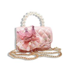 This pink iridescent purse is the definition of royal style! With a glimmering crown, charm bow and tulle polka dots, our quilted purse is perfect for your little princess! Comes with detachable gold chain. 5.5" Length x 4" Height x 2" Width Crown Applique, Elegant Purse, Hair Clip Holder, Crown Charm, Quilted Purse, Pink Crown, Pink Iridescent, Quilted Purses, Tie Headband