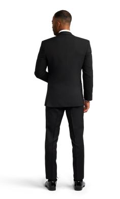 A slim black tuxedo with one button and a slightly rounded notch lapel. Black Tie Tuxedo Blazer With Hidden Button Closure, Tuxedo Blazer With Hidden Button Closure For Black Tie, Black Tie Tuxedo Blazer With Notch Lapel, Formal Black Tuxedo With Hidden Button Closure, Black Tuxedo With Hidden Button Closure For Formal Events, Black Tuxedo With Hidden Button Closure For Black Tie, Black Single-breasted Tuxedo For Black Tie, Black Tie Single Button Blazer With Notch Lapel, Black Single Breasted Tuxedo For Formal Occasions