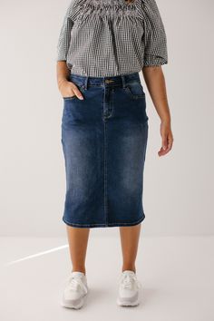 Trends come and go but denim remains a wardrobe staple! Crafted from a comfortable stretch denim in a timeless dark blue wash, the Wren will be your new go to skirt! The details include a traditional button and fly closure and functional pockets. And the very best part - this modest denim skirt comes in three lengths for you to choose from! Exclusively designed by us for you. 97% Cotton 3% Spandex Wash Cold Gentle Cycle Hang to Dry Low Iron if Needed Do Not Dry Clean Do Not Bleach Model Height 5 Christian Modesty Outfits, Short Sew In, Modest Denim Skirts, Modesty Outfits, Denim Skirt Outfits, Athletic Skort, Gingham Tops, Knee Length Shorts, Layered Tops