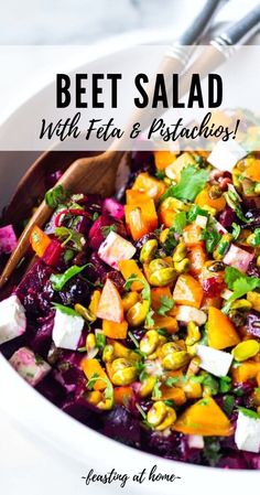 beet salad with feta and pistachios in a white serving bowl