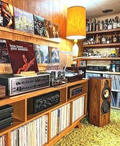 a room filled with lots of different types of audio equipment and record player's