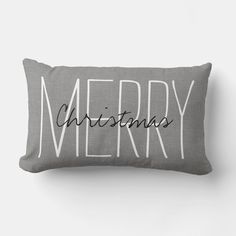 a grey pillow with the words merry on it