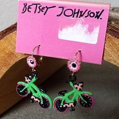 Betsey Johnson Mod Collection Watermelon Bike Leverback Earrings. Betsey Johnson 100% Authentic Back Sticker Has Fallen Off Over Time But There Is A Slight Outline Of Where It Was. Remnants Of Macy's Return Label On Front. Very Rare! Very Hard To Find Vintage 2010 - 2018 Mod Collection Gold Toned Alloy Metal Delicate Flower And Black Crystal Accents On The Wires. Pink, Green, And Black Enamel Watermelon Themed Bike / Bicycle Earrings. Leverback Style Dangle Earrings For Pierced Ears. Length 1.5" Bicycle Earrings, Mango Flower, Candy Corn Earrings, Cocktail Earrings, Betsey Johnson Earrings, Blue Crystal Earrings, Vintage Betsey Johnson, Sparkly Earrings, Heart Drop Earrings