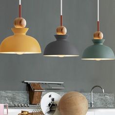 The metal material gives the pendant lamp a sturdy and premium texture, as well as good electrical conductivity, providing good illumination for the light. 
 Gray, green and yellow are the classic colors in the Morandi color palette, which not only have their own unique characteristics, but also look more elegant, understated and tasteful when paired together. These colors can bring a unique charm and visual impact to the pendant lamp. 
 The semi-circular design makes this chandelier look extra Pendant Light Set, Cheap Pendant Lights, Pendant Light Styles, Wood Pendant Light, Metal Pendant Light, Pale Colors, Wood Pendant, Light Bulb Types, Led Light Bulb