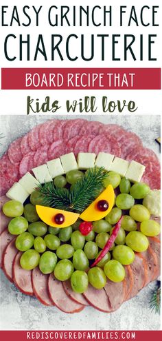 a platter with grapes, ham and cheese on it is featured in the article easy grin face charcuterie board recipe that kids will love