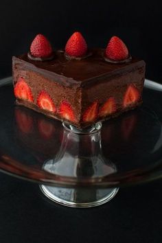 a piece of chocolate cake with strawberries on top