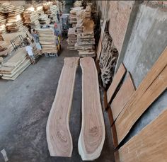 several pieces of wood sitting in a warehouse