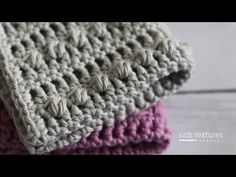 two crocheted blankets sitting on top of each other