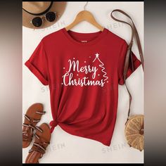 A Vibrant Red Crew Neck T-Shirt Featuring White 'Merry Christmas' Text And A Minimalist Christmas Tree Design On The Front, With A Relaxed And Tie Front Style. Christmas Shirts Vinyl, Christmas Ties, Red Crew Neck, Shirts Vinyl, Merry Christmas Text, Minimalist Christmas Tree, Christmas Text, T Shirts Ideas, Minimalist Christmas