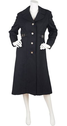 "This 1970s black coat is from Holt Renfrew's \"The 1300 Collection\", named after the store's Montreal address. It was union-made in Canada of a black wool with a black satin lining. It features rounded lapels, a pocket on each side, and silver metal hardware detailing on each side. It does up the front with four silver metal buttons. It's in excellent condition, has been professionally dry-cleaned and is ready to wear. Measurements: Bust - 40\" Waist - 37\" Hips - 42\" Shoulders - 16.5\" Arms Black Long Wool Coat With Button Closure, Vintage Black Wool Outerwear, Retro Black Wool Outerwear, Black Retro Wool Outerwear, Vintage Black Outerwear With Horn Royal Buttons, Vintage Black Outerwear For Work, Holt Renfrew, Frock Coat, Black Wool Coat