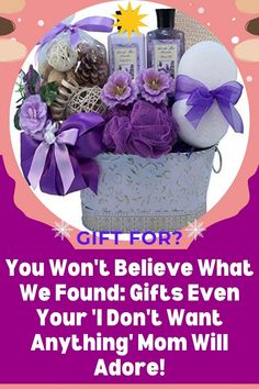 a gift basket with purple flowers, soaps and other personal care items in it