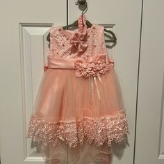 -Embroidery And Pearl Beaded Bodice -Tulle And Lace Trim Skirt -Satin Bow At The Waist -Hem Longer In The Back -Includes A Headband Spring Embellished Princess Dress For Dress-up, Spring Pink Embellished Princess Dress, Lace Trim Princess Dress For Dress-up, Lace Baptism Dress With Floral Applique For Parties, Pink Baptism Dress For Spring Pageant, Toddler Sweater Dress, Smocked Christmas Dresses, Lace Trim Skirt, Velvet Christmas Dress