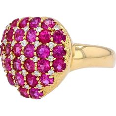 A heart-shaped ring, bursting with the vibrancy of deep red rubies, is the kind of piece that immediately steals attention. Set in rich 18K yellow gold, this stunning ring feels like a token of passion, radiating both elegance and luxury. The bold, saturated hues of the 2.18 carat rubies are perfectly complemented by the subtle brilliance of 0.15 carats of diamonds, strategically placed to create a mesmerizing lattice pattern. Each ruby sparkles under the light, drawing the eye in and leaving a Ruby Heart Ring, Light Drawing, Ruby Birthstone, Diamond Birthstone, Romantic Jewellery, Bold Jewelry, Heart Shaped Rings, Lattice Pattern, Yellow Gold Jewelry