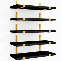 three black and gold shelves on the wall