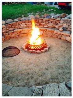 a fire pit in the middle of some rocks