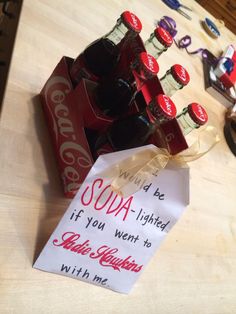 coca - cola bottles are sitting on a table next to a sign that says soda is limited if you went to coke with me