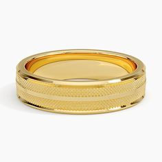 a gold plated ring on a white background