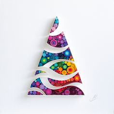 a colorful christmas tree made out of paper