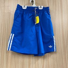 Adidas Blue Shorts Size Xs New With Tags Drawstring Waist In Excellent Condition With No Rips Or Stains Sold By Carousel Consignments In Okemos Michigan 5631-389/25/042441 Adidas Cotton Shorts For Summer, Adidas Cotton Bottoms For Summer, Casual Adidas Blue Shorts, Casual Blue Adidas Shorts, Blue Sporty Shorts With Pockets, Sporty Blue Shorts With Pockets, Blue Beachwear Bottoms With Elastic Waistband, Blue Beachwear Bottoms For Spring, Adidas Blue Sports Bottoms