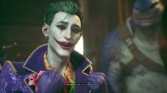 the joker is standing in front of two other characters