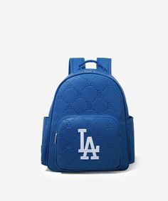 Made of synthetic leather LA logo is prominently embroidered on the front pocket. Top zipper closure Includes a spacious main compartment and a front zippered pocket for easy access to essentials. Side pockets provide additional storage options A zippered pocket on the back Adjustable padded shoulder straps 13.2"(L) x 6.5"(W) x 13"(H) Interior Capacity: Large Baseball Backpack, Dodgers Logo, Logo Making, Leather Rucksack, Weekend Bag, Pocket Top, Los Angeles Dodgers, Weekender Bag, Synthetic Leather