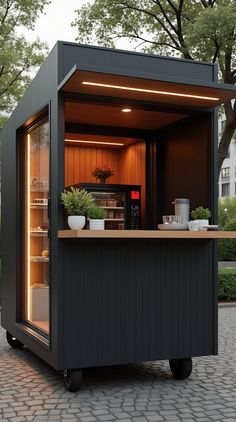 an outdoor kitchen with lights on the outside