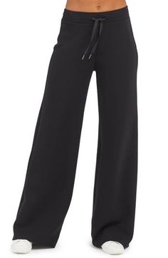 These throw-on-and-go pants are made from spacer fabric that's engineered with a cushiony, light-as-air feel. 30" inseam, 26" leg opening, 12" front rise, 15" back rise (size Medium) Elastic/drawstring waist 47% modal, 46% polyester, 7% elastane Dry clean or machine wash, tumble dry Imported Wide Comfy Pants, Black Womens Dress Pants, Straight Leg Sweat Pants, Black Comfy Pants, Dream Clothes Pants, Winter Workout Clothes, Open Leg Sweatpants, Black Wide Leg Sweatpants, Black Baggy Sweatpants