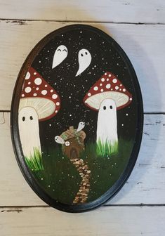 a painted plate with mushrooms and mice on it