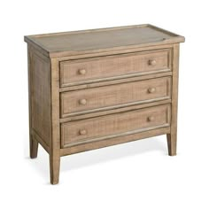 a wooden dresser with three drawers on it