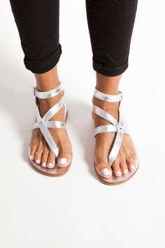 Silver Greek Leather Sandals, Womens Classic Sandals, Ankle Cuff Sandals, Flat Sandals, Ankle Strappy Sandals, Handmade Silver Sandals IRA IRA SANDALS Ankle cuff leather sandals with straps Silver colour / natural / black / brown / gold  Handmade sandals Leather straps and insole Rubber anti-slippery outsole All our sandals are inspired from the ancient grecian style and are made of the finest greek leather. Each pair is handmade by the most experienced craftsmen using the traditional greek techniques to ensure elegance and durability. Genuine leather can present small imperfections and variations of colour due to the nature of the material. That adds uniqueness on every pair. Leather is a flexible, breathable material.  Note that natural leather darkens with time. DHL EXPRESS WORLDWIDE  F Silver Ankle Strap T-strap Sandals For Summer, Silver Toe Post Sandals For Vacation, Silver Ankle Strap Sandals For Festival, Silver Single Toe Strap Sandals For Vacation, Bohemian Silver Open Toe Sandals, Silver Bohemian Open Toe Sandals, Silver Toe Loop Sandals For Summer, Silver Open Toe Barefoot Sandals For Summer, Silver Toe Ring Sandals For Summer Beach