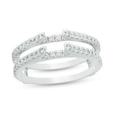 two white gold wedding bands with diamonds on each band, set in 18k white gold