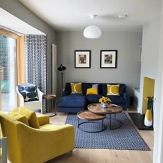 a living room with yellow and blue furniture