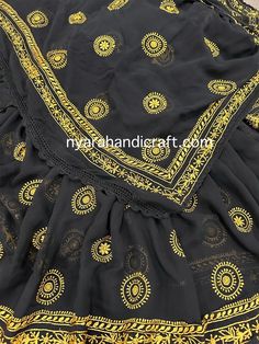 Pure georgette Chikankari saree with hand embroidery. Yellow motifs skillfully embroidered with fine resham thread. Fall Attached. No blouse piece. Black Choli With Intricate Embroidery In Georgette, Navratri Georgette Sharara With Motifs, Traditional Black Choli With Motifs, Diwali Black Saree With Chikankari Embroidery, Georgette Sharara With Motifs For Festivals, Black Saree With Chikankari Embroidery, Festival Sharara In Georgette With Motifs, Festive Black Saree With Chikankari Embroidery, Black Embroidered Saree For Navratri