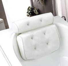 a white bath tub sitting next to a window