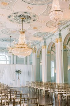 an empty ballroom with chandeliers and chairs set up for a wedding ceremony at the grand america hotel