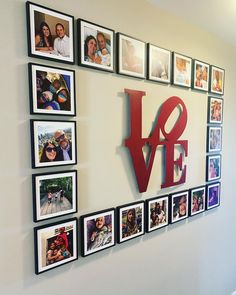 a wall that has pictures on it with the word love spelled in red