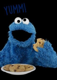 the cookie monster is eating cookies with his eyes wide open