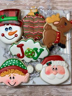 decorated cookies in the shape of christmas characters