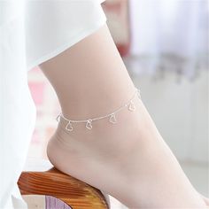 This anklet features delicate, crush-worthy heart shapes you'll love to wear. 7.87" L with 1.96" extender Lobster claw clasp Silvertone copper Peach Bracelet, Heart Bracelets, Wedding Bride Jewelry, Silver Heart Bracelet, Silver Bracelets For Women, Sterling Silver Anklet, Hollow Heart, Silver Anklets, Foot Jewelry