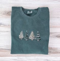 This is a one of a kind embroidered sweatshirt that your gonna absolutely love. This is the perfect gift! HOW TO ORDER Select your sweatshirt size from the first dropdown menu.  To send a sweatshirt directly to the recipient, please mark "This order is a gift" at checkout and include a gift message. SHIPPING  Your sweatshirt will ship within 4-7 business days. All shipments include a tracking number via USPS. All the shipping information will be sent to your email. If you need it by a certain da Embroidered Cotton Christmas Sweatshirt, Christmas Crew Neck Sweatshirt With Embroidered Graphics, Christmas Crew Neck Sweatshirt With Embroidered Logo, Christmas Embroidered Crew Neck Sweatshirt, Holiday Embroidered Crew Neck Sweatshirt, Embroidered Crew Neck Sweatshirt For Holiday, Christmas Holiday Embroidered Sweatshirt, Embroidered Christmas Holiday Sweatshirt, Embroidered Long Sleeve Christmas Sweatshirt