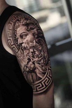 a man with a tattoo on his arm that has an image of the greek god