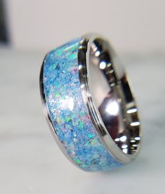 😀Free of Charge: Premium Black LED Ring Box is included with your order. 💗Thank you for visiting my shop. I strive to make beautiful and compelling rings that move people and make them smile. I personally handcraft each ring in my Portland, Oregon studio with only the finest, most brilliant materials. 💍I love to make customs rings for engagements, weddings, gifts and every-day use. Please reach out to me if there is something special that I can make for you.  💕Giving Back My goal in life is Iridescent Ring For Anniversary, Iridescent Ring Jewelry For Anniversary, Iridescent Jewelry For Anniversary, Sparkling Round Crystal Gift Ring, Sparkling White Gold Ring For Gift, Sparkling White Gold Ring Perfect As A Gift, Sparkling White Gold Ring Perfect For Gifts, Sparkling White Gold Ring As A Gift, Round Glitter Jewelry As Gift