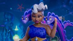 the animated character is dressed in blue and has gold jewelry on her head, while she stands next to a purple dragon