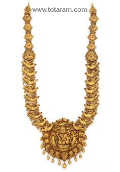 22 karat gold "lakshmi - peacock " long necklace with  beads (temple jewellery)  enhance your beauty with 22 karat gold lakshmi-peacock long necklace!  indulge in the exquisite craftsmanship of this stunning 22 karat gold lakshmi-peacock long necklace from totaram jewelers. made in india, this temple jewelry piece is a true symbol of elegance and tradition. the intricate design features a beautiful lakshmi and peacock motif, exuding grace and charm.  adorn yourself with this timeless piece and m Peacock Motif, 22k Gold Necklace, Gold Temple Jewellery, Temple Jewelry, Indian Heritage